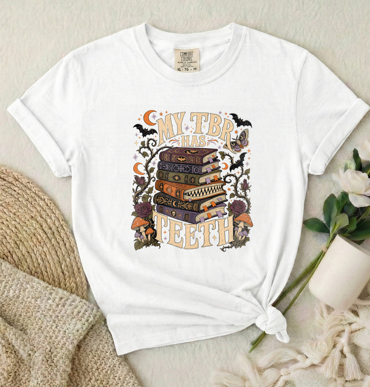 T-Shirt — “My TBR Has Teeth” Stack of Spooky Books Graphic Tee
