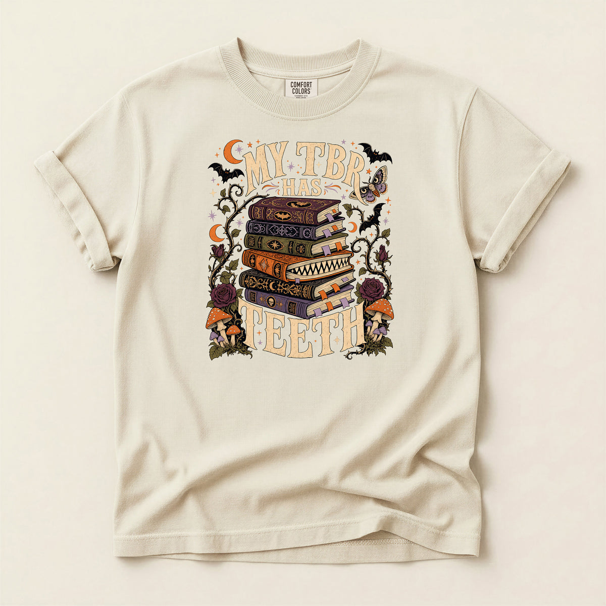 T-Shirt — “My TBR Has Teeth” Stack of Spooky Books Graphic Tee
