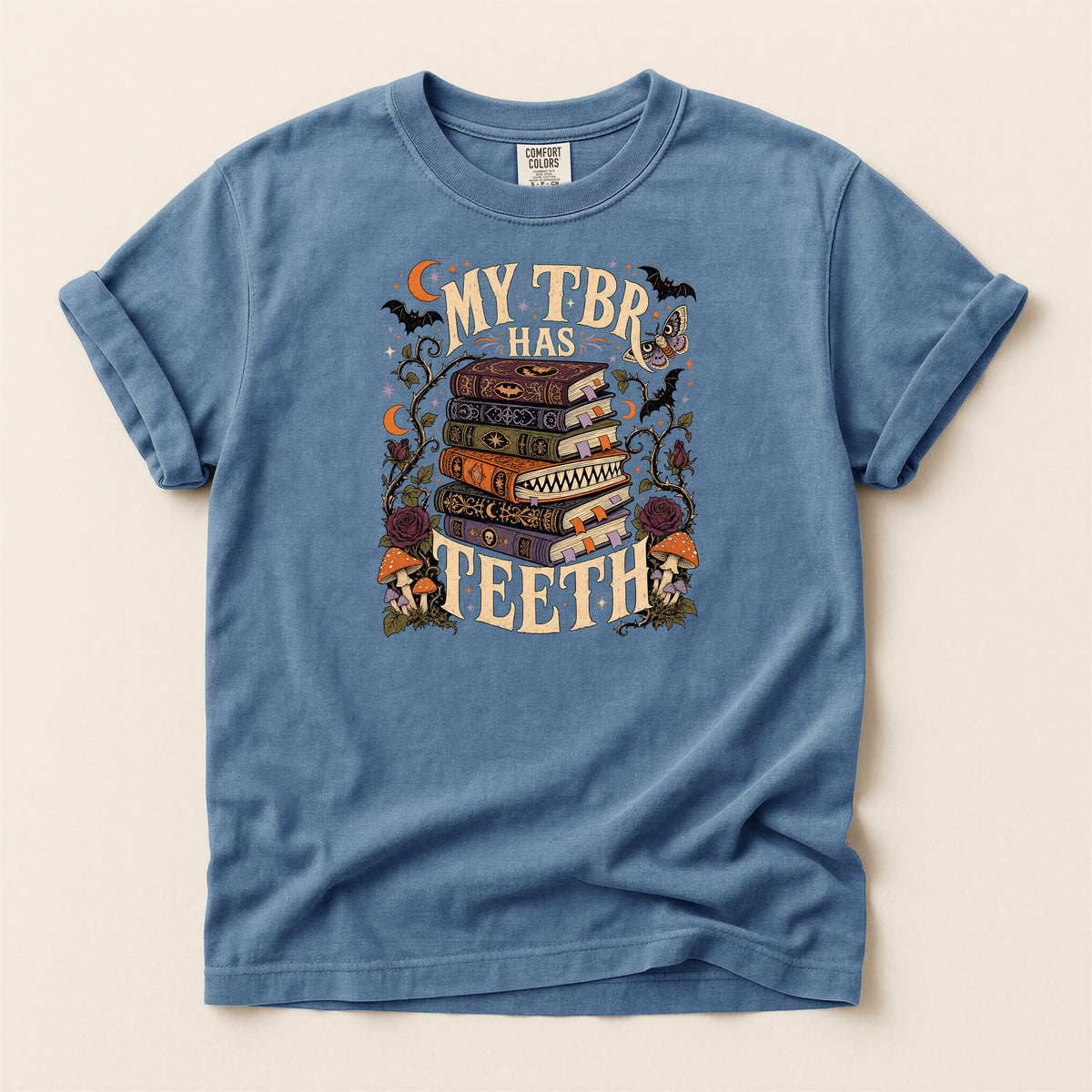 T-Shirt — “My TBR Has Teeth” Stack of Spooky Books Graphic Tee