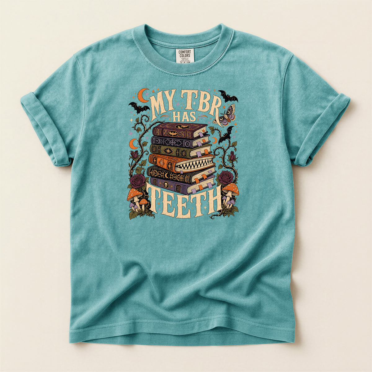 T-Shirt — “My TBR Has Teeth” Stack of Spooky Books Graphic Tee